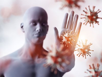 Illustration of human blocking large, visible viruses with hand. 