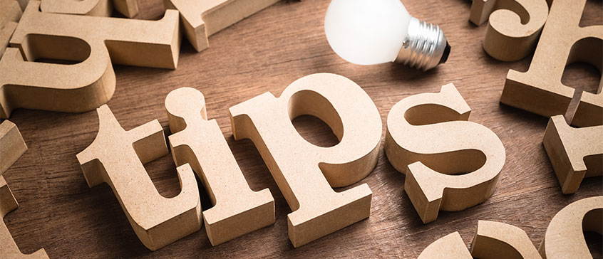 Photo of wood blocks letters that spell out the word "tips".