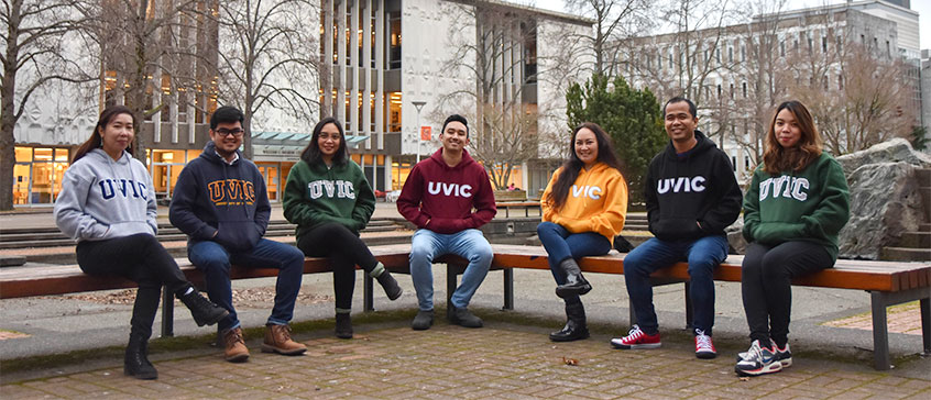 Members sitting on a bench.