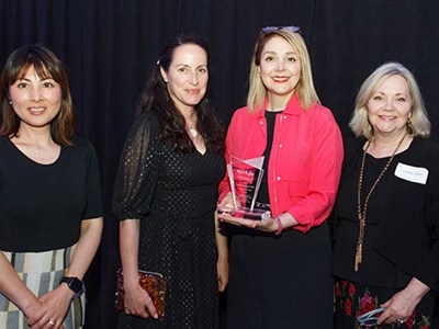 Photo of a group of women accepting an award.