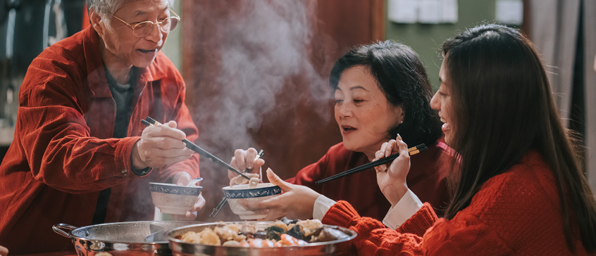 People sharing Chinese food 