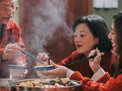 People sharing Chinese food 