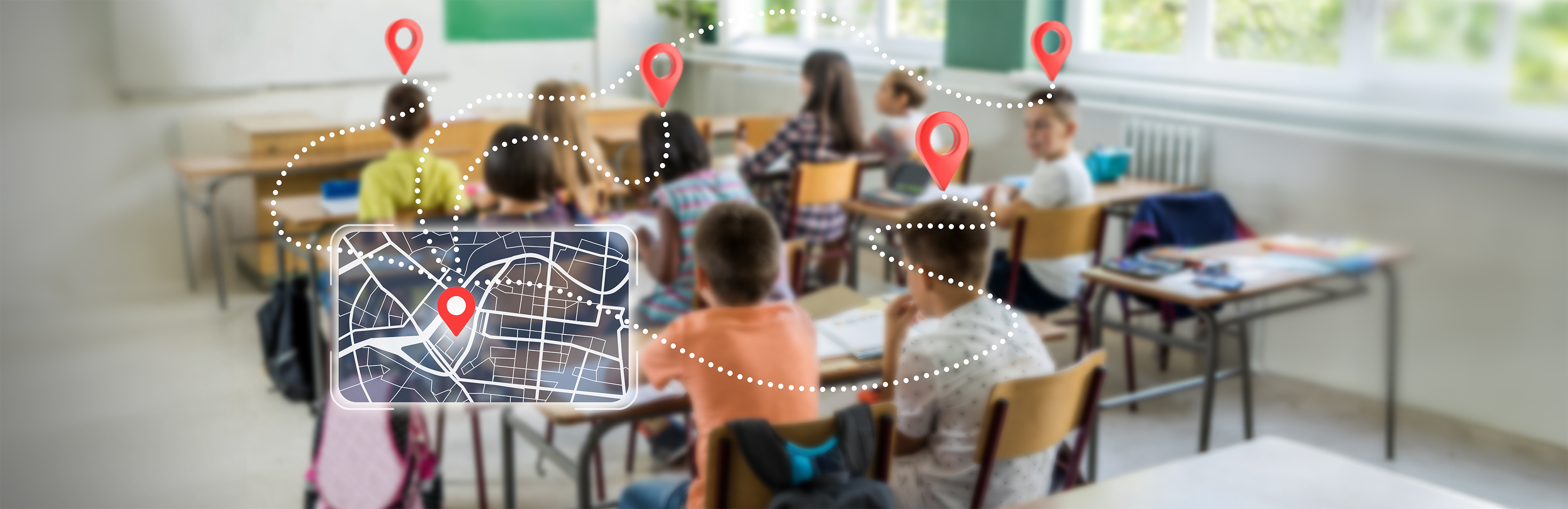 A blurred photo of children actively learning in a classroom. Overlaid a tablet showing navigation icons to symbolize navigating the wide needs of literacy in the classroom