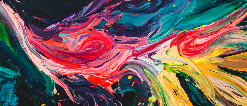Close-up of colorful abstract paint strokes in vibrant shades of red, blue, yellow, purple, and pink, creating a dynamic and textured composition.