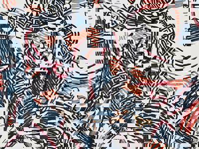 Energetic overlapping scribbles in red, yellow, and blue marker on a white background, with loose, vertical strokes that convey playful experimentation with color and line