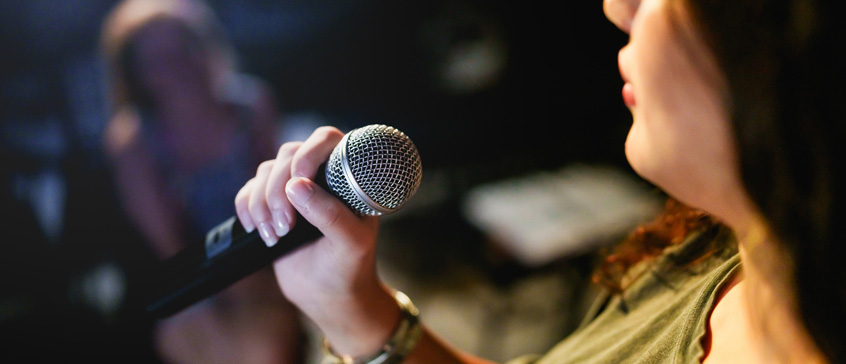 Woman holding microphone