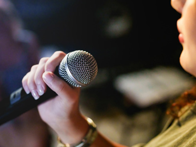 Woman holding microphone