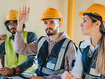 Construction workers at a team meeting