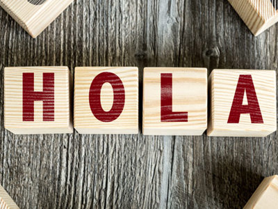Wooden blocks spell out HOLA