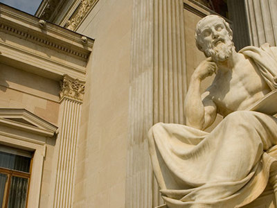 Photo of pensive statue.