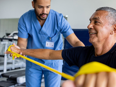 Health care worker tends to elderly patient