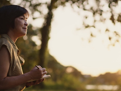 Woman outdoors gazing into distance