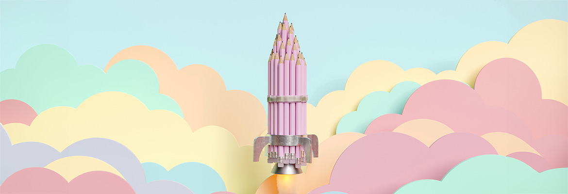 Rocket shape made up of a group of pink pencils flying over pastel coloured flat clouds 