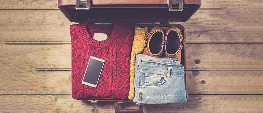 Photo of a suitcase packed with clothes