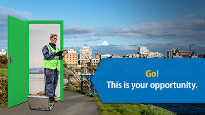 Text "Go! This is your opportunity" overtop a worker in a high vis vest walking through a door to the inner harbour in Victoria, BC.