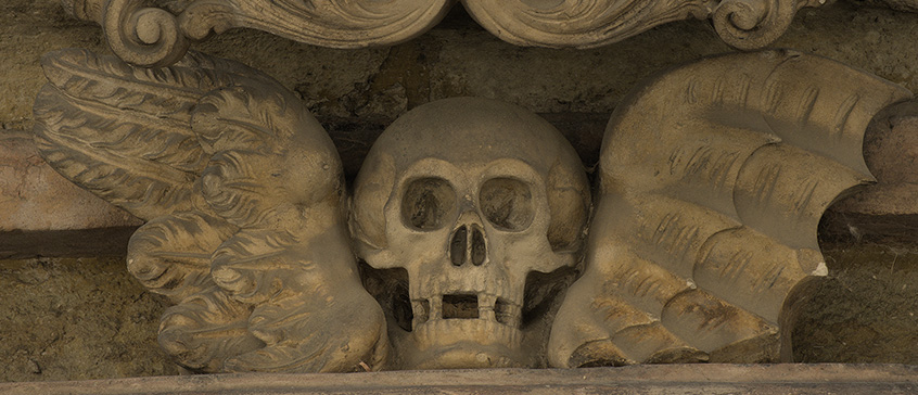 Skull with wings ornament in gothic style in a medieval city