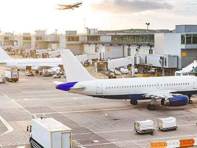Photo of airplane at terminal.
