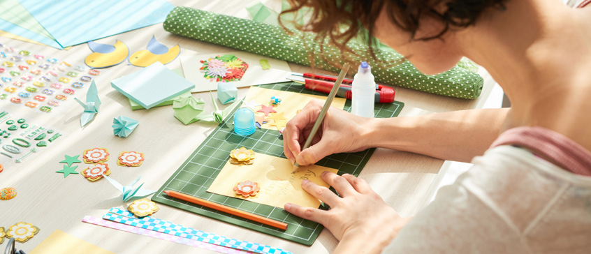 Woman creating a greeting card