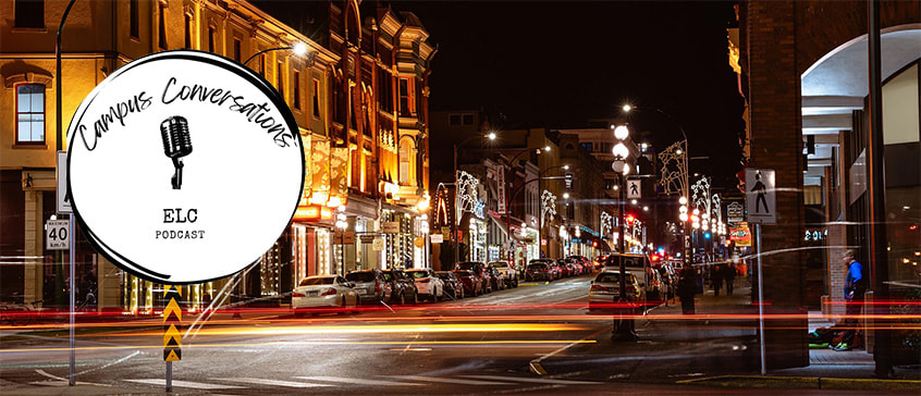 Victoria downtown street at night with Campus Conversations logo overlaid. 