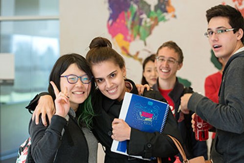 A photo of young students smiling.