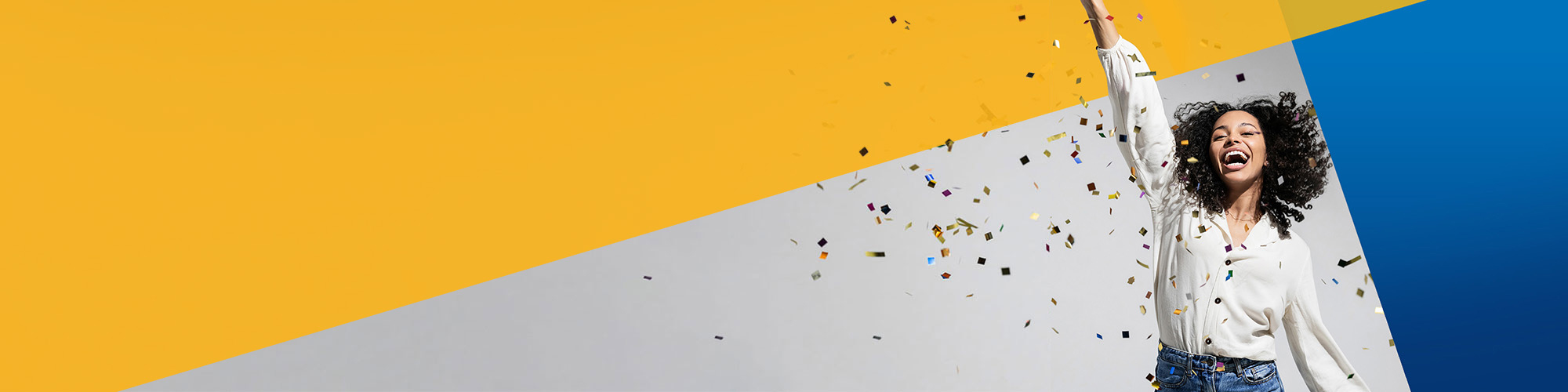 Smiling woman throwing confetti with a colourful geometric background.