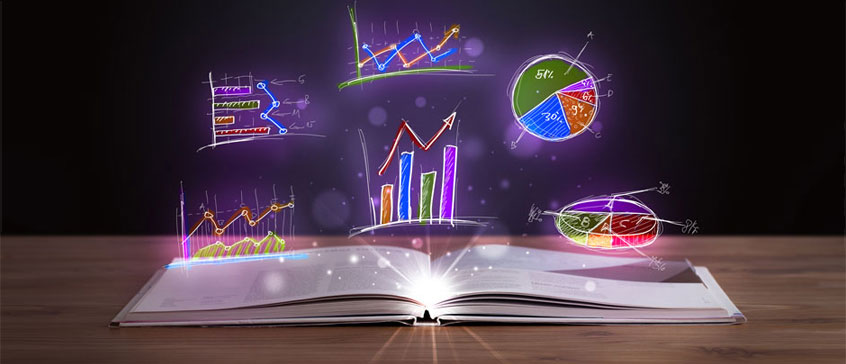 Illustrated graphs and pie charts being projected out of an open book on a table. 