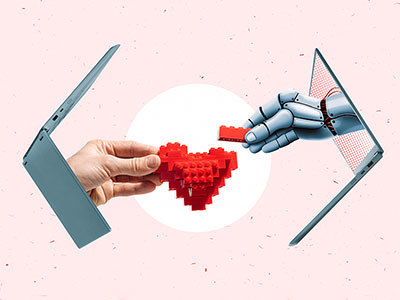 Human hand and Robot hand constructing a lego heart