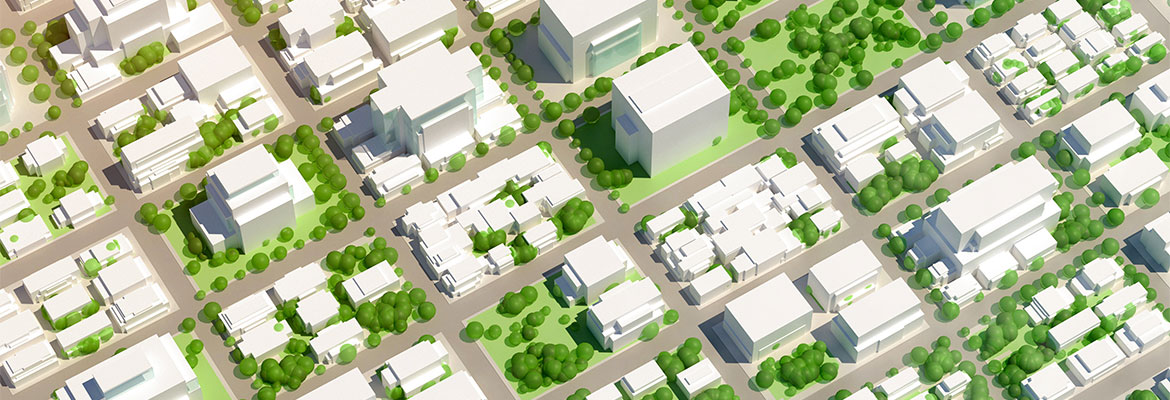  An aerial view of a cityscape model featuring white buildings and green spaces, illustrating urban planning and sustainable development.