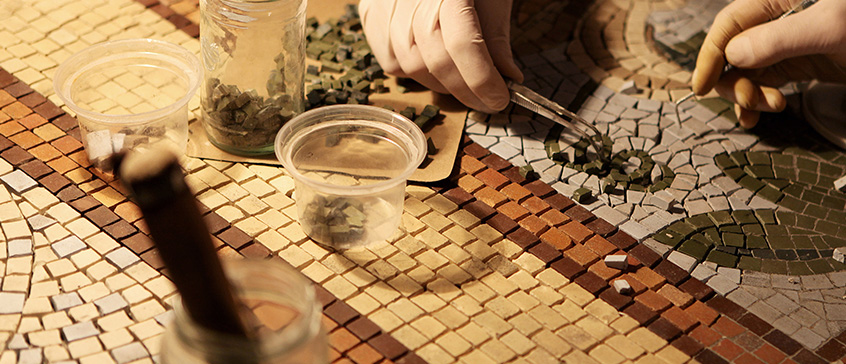 Photo of table packed with artifacts.