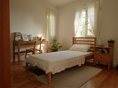Homestay private room with bed.