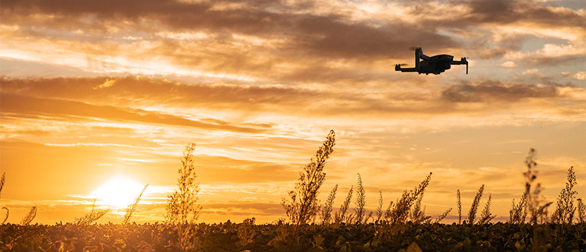 Photo of drone against sunset. 