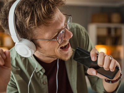 Man singing with headphones on.