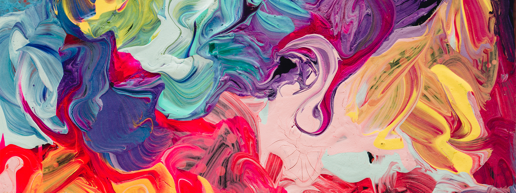 Abstract swirls of colourful paint.
