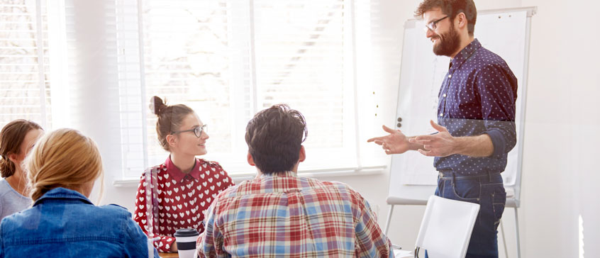 Photo of a team meeting. 