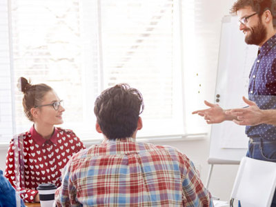 Photo of facilitator working with a small work team.