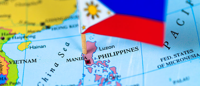 Map of the world with a Filipino flag on the Philippines,
