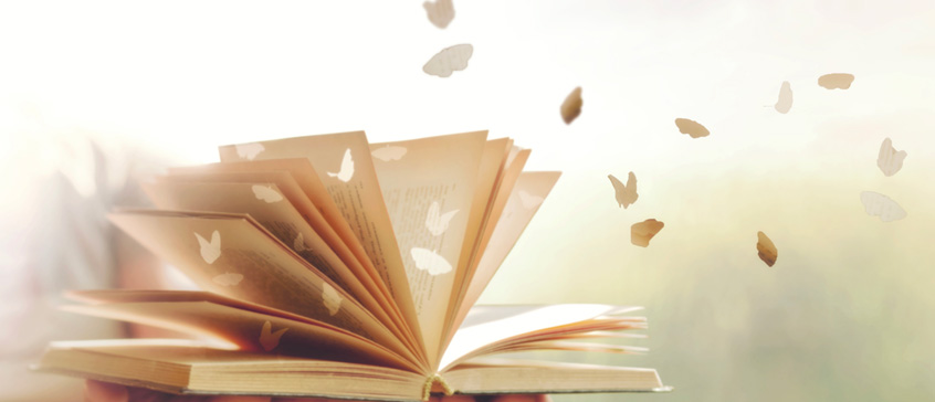 Illustrations of butterflies flying out of pages of book