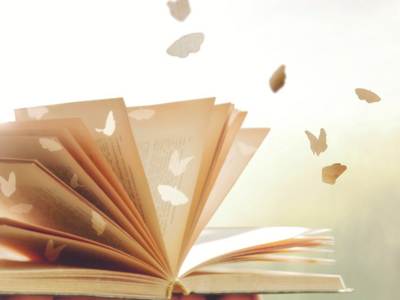 Illustrations of butterflies flying out of pages of book
