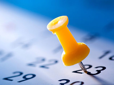 Thumbtack on a calendar