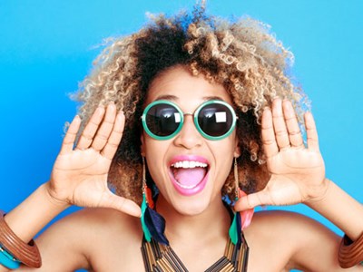 Woman wearing bright sunglasses and lipstick